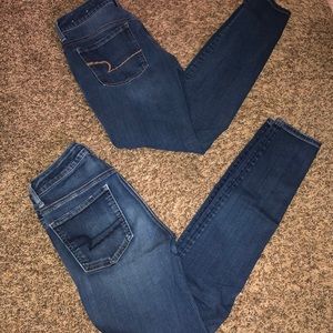 two pairs of american eagle jeans